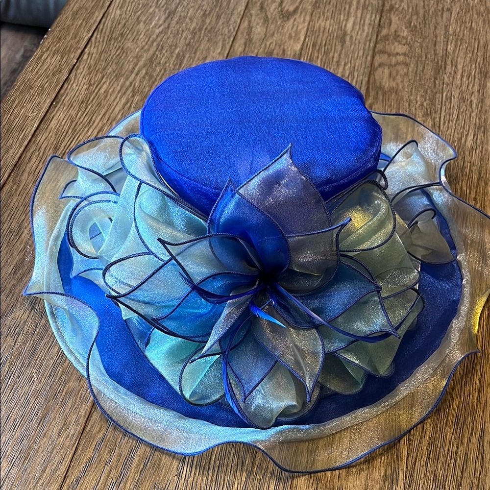 Elegant Blue Hat with Wide Brim and Flowing Decoration